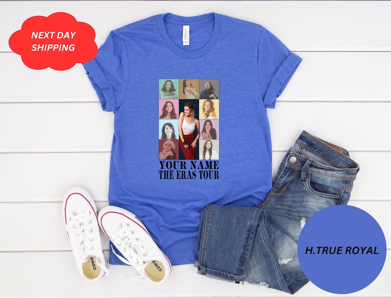 May include: A royal blue t-shirt with a collage of photos of a woman in different outfits and hairstyles. The text "YOUR NAME THE ERAS TOUR" is printed below the collage.