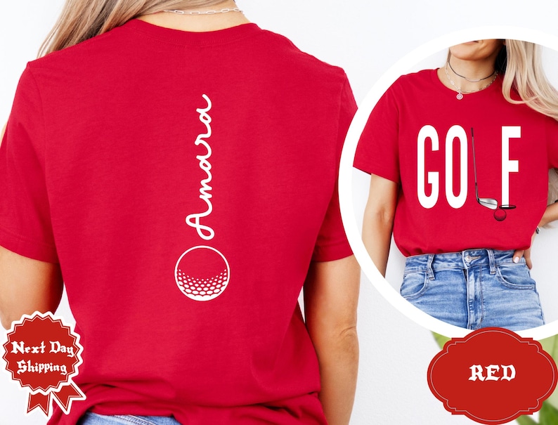 May include: Red t-shirts with golf-themed designs. One shirt features the word "GOLF" with a golf club and ball graphic. The other shirt has the name "Amara" and a golf ball graphic.