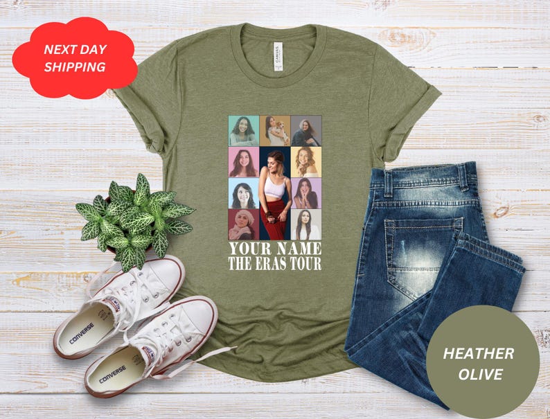 May include: A green t-shirt with a collage of photos of a woman in different outfits. The text "YOUR NAME THE ERAS TOUR" is printed on the shirt.
