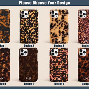 May include: Eight phone cases with a tortoiseshell pattern in various shades of brown and tan. Each case has a different name or initials printed on it. The text "Please Choose Your Design" is at the top.