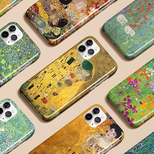 May include: A collection of phone cases featuring famous artworks. The cases display vibrant reproductions of paintings with various color palettes, including gold, green, and floral designs. The cases have a glossy finish and are arranged on a neutral background.