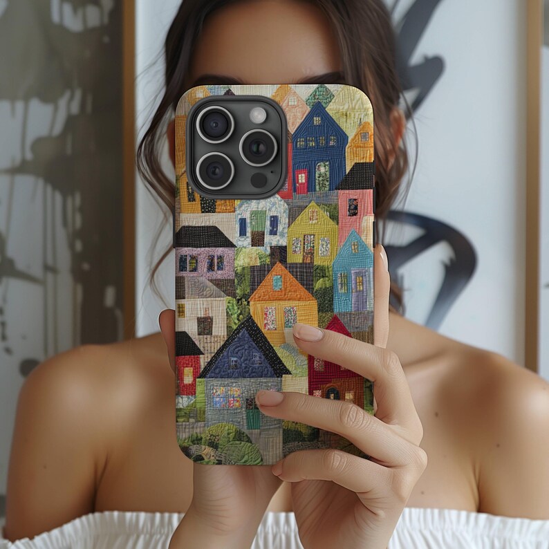 May include: A colorful phone case with a patchwork design of houses. The case features a variety of colors and patterns, including red, blue, green, yellow, and brown. The case is made of a durable material and is designed to protect your phone from scratches and bumps.