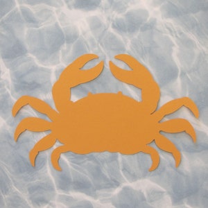 May include: A cutout of a crab in a bright orange color against a blue and white marbled background.