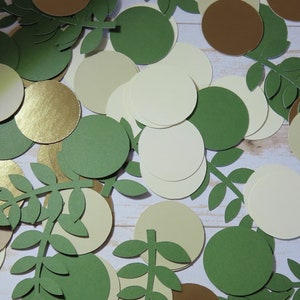 May include: Assortment of green, gold, brown, and cream paper circles and leaf shapes. The circles are various sizes and the leaves are all the same size.