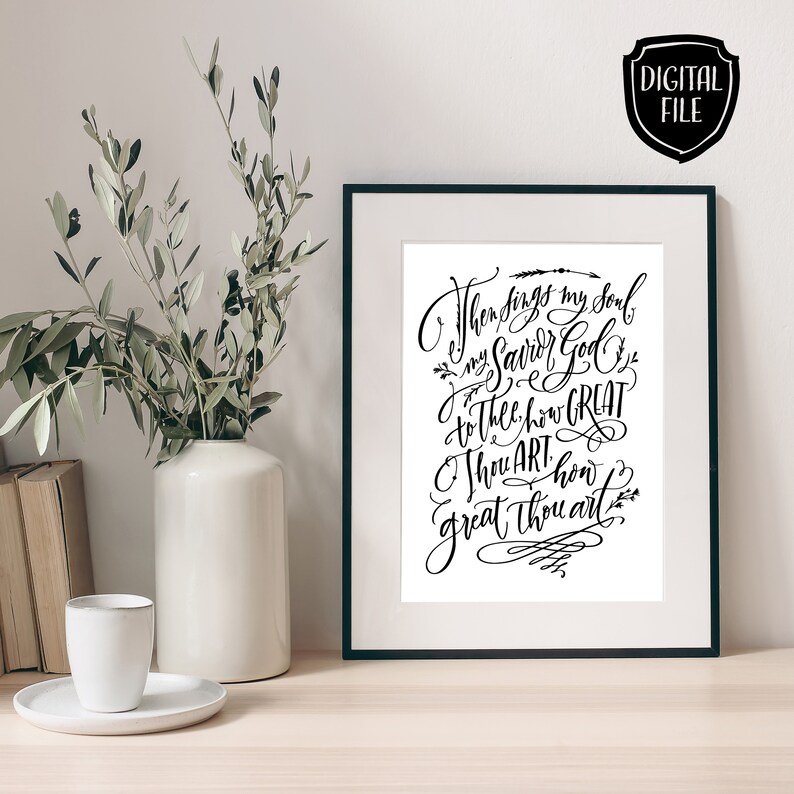 May include: Black framed art print with elegant calligraphy. The text reads "Then sings my soul, my Savior God, to Thee, how GREAT Thou art, how great Thou art." A digital file icon is in the upper right corner.