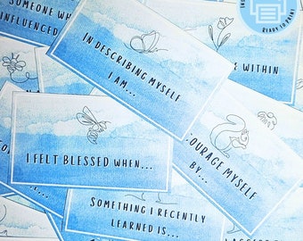 May include: A set of blue and white printable cards with watercolor backgrounds and black line drawings. The cards feature prompts for self-reflection, such as "Someone who influenced me", "In describing myself, I am...", "I felt blessed when...", "Something I recently learned is...", "Courage myself by...", and "Accept the week by...".