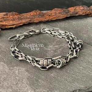 Multi chain, layered, raw sterling bracelet.