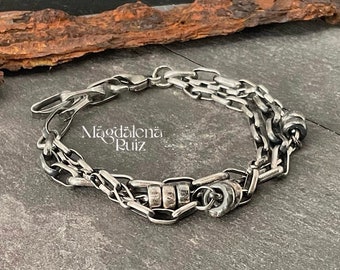 Multi chain, layered, raw sterling bracelet.