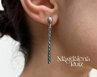 Long, studded, bar earrings. Sterling silver lost wax cast. Raw brutalist style.