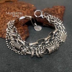 Chunky, heavy solid sterling bracelet, multi chain, layered with cast components.