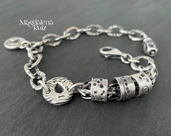 Solid silver bracelet with unique cast components and chain. Industrial, boho style.