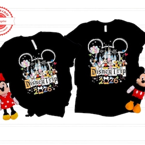two black t-shirts with Disney-themed graphics and text, along with a stuffed Minnie Mouse toy.