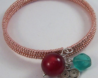 Pink Charm.. Pink and turquoise czech glass, seed bead memory bangle bracelet