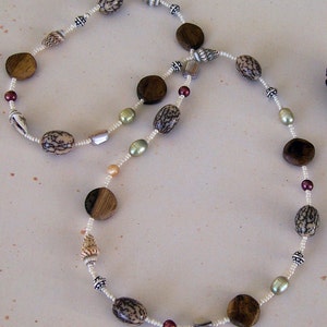 Naturals.. Betel nut, wood, freshwater pearl, shell and seed bead necklace, sterling silver