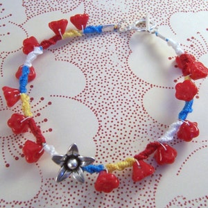 Firecracker.. Red yellow and blue embellished friendship bracelet