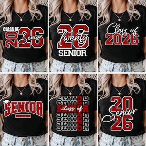 May include: Black t-shirts with red and white graphics celebrating the class of 2026. Designs include "Class of 2026 Senior", "26 Twenty Senior", and "Senior Class of 2026". The shirts are worn by a person.