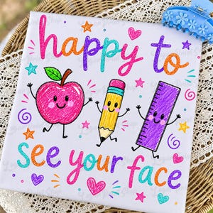 May include: A white square canvas featuring the colorful text "happy to see your face" in a handwritten style. Below the text are three cartoon characters: a pink apple, a yellow pencil, and a purple ruler, all with faces, arms, and legs.