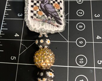 F Caw F badge reel