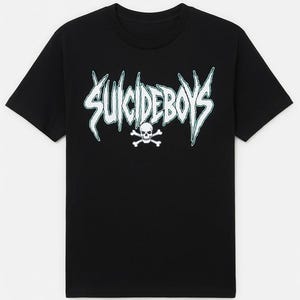 May include: Black t-shirt with the text "SUICIDEBOYS" in a jagged, stylized font with a teal outline. A white skull and crossbones graphic is below the text. The shirt has short sleeves and a crew neck.