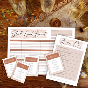 May include: A set of printable bridal shower games with a blush pink and brown color scheme. The games include "Stadt, Land, Braut", "Braut-Quiz", "Flitterwochen", "IGA", "Brautstrauß", and "Fotograf in".