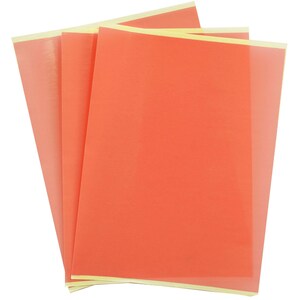 May include: A stack of rectangular sheets of translucent coral-colored film. Each sheet features a smooth, semi-transparent surface with a light-colored adhesive strip along the top edge, allowing for layering and visibility through the material.
