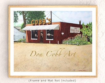 Puede incluir: Una pintura de acuarela de un edificio de ladrillo rojo con un letrero que dice "Cobb's Bar-B-Q Since 1953". El edificio tiene un toldo blanco y un letrero que dice "Cobb's". La pintura está firmada "Don Cobb Art".