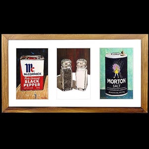 May include: A framed illustration of three spice containers. The left container is red and white with the text "McCormick Pure Ground Black Pepper" and a blue bird. The center image shows two salt and pepper shakers. The right container is blue and white with the text "Morton Salt" and a girl with a pink umbrella.