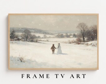 May include: A rectangular framed wall art piece featuring a winter landscape painting of a child holding hands with a snowman in a snow-covered field. The scene includes bare trees, rolling hills, and falling snow under a muted, overcast sky.