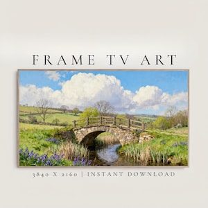 May include: A framed landscape painting featuring a stone bridge over a stream, with fields and trees under a blue sky with fluffy white clouds. The text "FRAME TV ART" is at the top, and "3840 X 2160 | INSTANT DOWNLOAD" is at the bottom.
