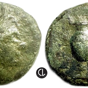 May include: Two antique bronze coins. The coins are circular with a weathered, textured surface. One coin features a sunburst design, the other has a raised relief image. The coins have a green patina.