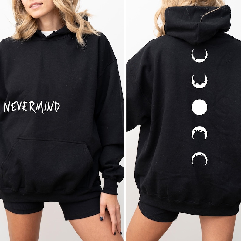 May include: Black hoodie with the word "NEVERMIND" in white script on the front. The back of the hoodie features a vertical design of white moon phases. The hoodie has a front pocket and a hood.