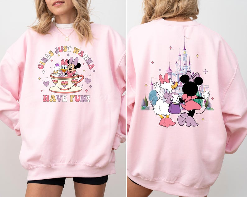 May include: Pink sweatshirt with a graphic of Mickey Mouse and Minnie Mouse in a teacup with the text "Girls Just Wanna Have Fun!"