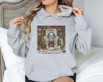 Funny Book Lover Hoodie, Shhh We're Trying to Read Hooded Hoodie, Cryptid Reading Hoodie, Bigfoot Bookworm Gift
