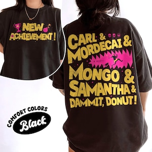 May include: Black t-shirt with a graphic print of the text "NEW ACHIEVEMENT!" on the front and the text "CARL & MORDECAI & MONGO & SAMANTHA & DAMMIT, DONUT!" on the back.