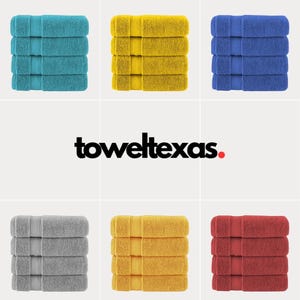 May include: Six stacks of towels in various colors, including teal, yellow, blue, gray, and red. The towels are folded and stacked on a white background. The text "toweltexas." is displayed in black with a red dot.