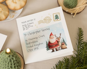 May include: A festive Christmas card featuring Santa Claus and a reindeer illustration. The card is addressed to Christopher Henries, with an address in Bedfordshire, UK. Includes a Christmas tree stamp and the text "Express Delivery".