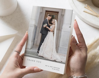 May include: A wedding thank you card with a photo of a bride and groom in front of a building. The text on the card reads "Thank You" and "Mr. & Mrs. Denver 12.06.2023".