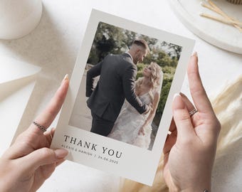 May include: A white thank you card with a photo of a bride and groom. The text on the card reads "Thank You" and "Alexis & Hamish | 24.06.2025".