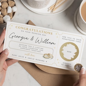 May include: A wedding day congratulations card with the names Georgia & William in elegant script. The card includes a scratch-off area for a honeymoon fund, with the text "Add this to your honeymoon fund" and "Scratch to reveal."