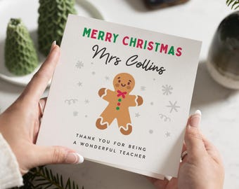 May include: A Christmas card with a gingerbread man illustration and the text "Merry Christmas Mrs. Collins Thank you for being a wonderful teacher".