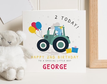 May include: A birthday card with a cartoon tractor driven by a blue dinosaur, holding balloons. The card reads "2 TODAY!" and "HAPPY 2ND BIRTHDAY TO A SPECIAL LITTLE BOY GEORGE."