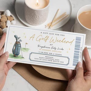 May include: A gift certificate for a golf weekend, held by a person. The certificate has a watercolor illustration of a golf bag and a flag on a green. Text includes "A Golf Weekend" and "Happy Birthday Dad!"