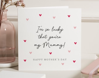 May include: A white Mother's Day card with the message "I'm so lucky that you're my Mummy!" in black script. The card is decorated with scattered pink and red hearts. The words "Happy Mother's Day" are printed at the bottom.