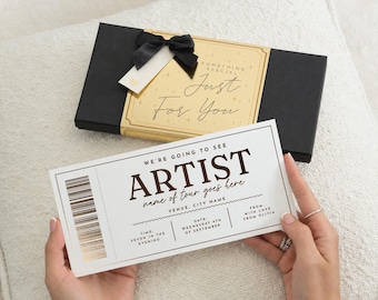 May include: A rectangular black gift box with a gold label reading Something Special Just For You and a black ribbon, paired with a white rectangular ticket featuring the text We're Going To See Artist, Name of tour goes here, Venue, City Name, Date, Wednesday 9th of September, Time, Seven in the evening, From, With Love From Olivia.