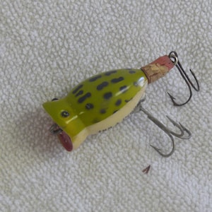 1950s fishing lure with hole through center 1950 Fishing Lures