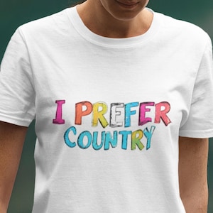 ミュージック ノスタルジア I Prefer Country ユニセックス コットン T シャツ、カラフルなレトロ ヒッピー スタイル トップ、芸術的なタイポグラフィ デザイン