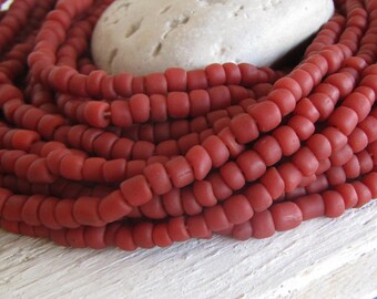 red brown glass seed bead, matte barrel tube, small  ethnic spacer , indonesian 4 to 6mm dia, new indo-pacific (22 inches) 22ab14-2