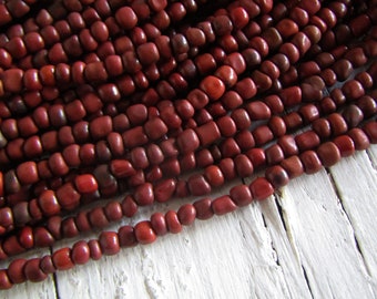 brown red seed beads, red glass beads, opaque dark  rustic   irregular organic tube rondelle Indonesia  - 3mm  to 5mm (44 inch ) 23ab4-9