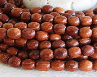 Oval bayong wood beads ,  orange brown , finished,  6mm - 7mm dia x 8mm - 9mm long  ( 28 inches  strand) 20ab36