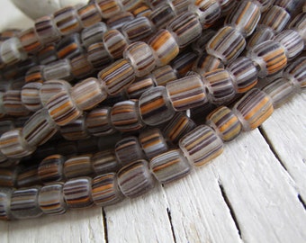 small glass seed beads, orange black clear ,  striped spacer barrel tube, New Indo-pacific  4mm to 6mm dia (22 inches strd ) 23ab27-10